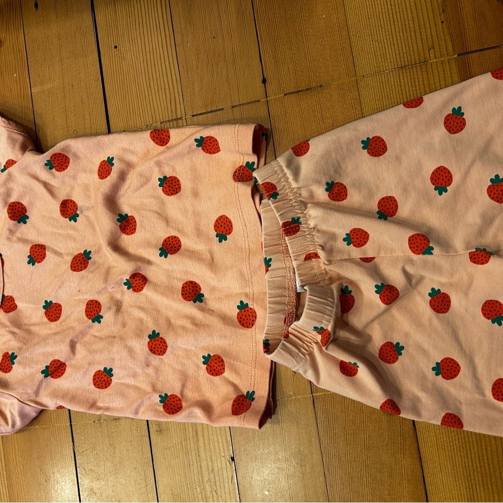 Hanna Anderson pink strawberry warm weather pajama set. Two small stains on top.
